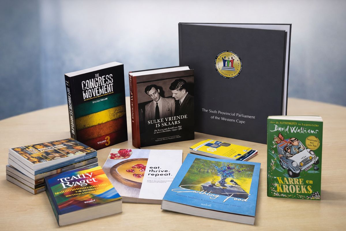 A spread of books and printed work by Capitil Press